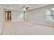 Spacious bedroom featuring neutral walls, plush carpet, a ceiling fan, and plenty of natural light at 1040 Sadie Ridge Rd, Clermont, FL 34715