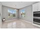 Cozy breakfast nook with natural lighting and tile flooring, adjacent to kitchen appliances at 1040 Sadie Ridge Rd, Clermont, FL 34715