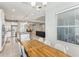 Dining room with wood table and chairs, open to kitchen at 1040 Sadie Ridge Rd, Clermont, FL 34715