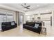 Open living room showcasing a kitchen with granite countertops and stainless steel appliances at 1040 Sadie Ridge Rd, Clermont, FL 34715