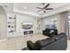 Modern living room with built-in shelving and electric fireplace at 1040 Sadie Ridge Rd, Clermont, FL 34715