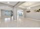 Inviting living space with view of the kitchen and dining area, tile flooring, and lots of natural light at 1040 Sadie Ridge Rd, Clermont, FL 34715