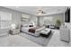 Serene main bedroom with carpet, natural light, a ceiling fan, and contemporary decor at 1040 Sadie Ridge Rd, Clermont, FL 34715