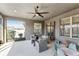 Relaxing screened porch with seating area at 1040 Sadie Ridge Rd, Clermont, FL 34715