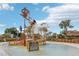 Community water park area with slides, splash zone, play features, and shaded seating at 1040 Sadie Ridge Rd, Clermont, FL 34715