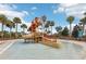 Community water park featuring a water slide and a splash bucket with palm trees at 1040 Sadie Ridge Rd, Clermont, FL 34715