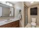 Clean bathroom with shower, vanity, and linen cabinet at 106 Canterbury Dr, Haines City, FL 33844