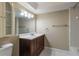 Clean bathroom with a vanity, mirror, and bathtub at 106 Canterbury Dr, Haines City, FL 33844