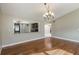 Dining room with hardwood floors and kitchen view at 106 Canterbury Dr, Haines City, FL 33844