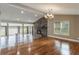 Dining room with hardwood floors, stone fireplace, and chandelier at 106 Canterbury Dr, Haines City, FL 33844