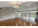 Bright dining room with hardwood floors and a chandelier at 106 Canterbury Dr, Haines City, FL 33844