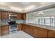 Kitchen with stainless steel appliances and granite countertops at 106 Canterbury Dr, Haines City, FL 33844