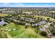 Aerial view of a residential neighborhood with golf course and lake at 1105 Harbor Hill St, Winter Garden, FL 34787