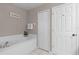 Bathroom with a garden tub and double door linen closet at 1105 Harbor Hill St, Winter Garden, FL 34787