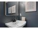 Modern bathroom with white sink and dark vanity at 1105 Harbor Hill St, Winter Garden, FL 34787