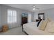 Main bedroom with private balcony access and a ceiling fan at 1105 Harbor Hill St, Winter Garden, FL 34787