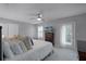 Main bedroom with private balcony access and a ceiling fan at 1105 Harbor Hill St, Winter Garden, FL 34787