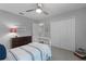 Charming bedroom with a metal bed frame and double door closet at 1105 Harbor Hill St, Winter Garden, FL 34787