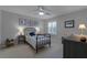 Cozy bedroom with a metal bed frame and neutral decor at 1105 Harbor Hill St, Winter Garden, FL 34787