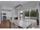 Kitchen and dining area with sliding doors to backyard pool at 1105 Harbor Hill St, Winter Garden, FL 34787