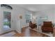 Living room features hardwood floors, two leather armchairs, and a large window at 1105 Harbor Hill St, Winter Garden, FL 34787