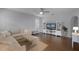 Living room with L-shaped sofa and hardwood floors at 1105 Harbor Hill St, Winter Garden, FL 34787