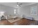 Living room with L-shaped sofa and wood floors at 1105 Harbor Hill St, Winter Garden, FL 34787