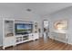 Living room with built-in entertainment center and hardwood floors at 1105 Harbor Hill St, Winter Garden, FL 34787