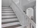 Staircase with white railing and wood steps at 1105 Harbor Hill St, Winter Garden, FL 34787