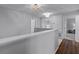 Upstairs hallway with multiple doors and neutral-toned walls at 1105 Harbor Hill St, Winter Garden, FL 34787