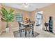 Dining area with a four-person table and access to the kitchen at 1107 Lantana Dr, Eustis, FL 32726