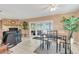 Bright dining room with a table and chairs near a fireplace at 1107 Lantana Dr, Eustis, FL 32726