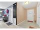 Bright entryway with white door and tile flooring at 1107 Lantana Dr, Eustis, FL 32726