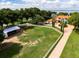 Aerial view of the property showing house and grounds at 11148 Lane Park Rd, Tavares, FL 32778