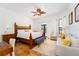 Bedroom with a wooden bed frame and a sitting area at 11148 Lane Park Rd, Tavares, FL 32778