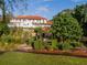 Lush landscaping surrounds the home with an intricate walkway leading to the backyard at 11148 Lane Park Rd, Tavares, FL 32778