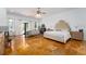 Large main bedroom with a plush bed and sitting area at 11148 Lane Park Rd, Tavares, FL 32778