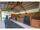 Spacious stable with multiple stalls and fans at 11148 Lane Park Rd, Tavares, FL 32778