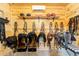 Well-organized tack room featuring wooden walls and a variety of equipment at 11148 Lane Park Rd, Tavares, FL 32778