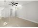 Spacious bedroom with tile floor and ensuite bathroom at 1141 Edgewood Ranch Rd, Orlando, FL 32835