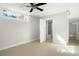 Bright bedroom with bathroom access and tile floors at 1141 Edgewood Ranch Rd, Orlando, FL 32835