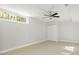 Large bedroom with ceiling fan and window at 1141 Edgewood Ranch Rd, Orlando, FL 32835