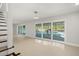 Bright Gathering room with pool view, tile floors, and sliding glass doors at 1141 Edgewood Ranch Rd, Orlando, FL 32835