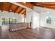 Living room boasts vaulted wood ceilings, hardwood floors, and water views at 1141 Edgewood Ranch Rd, Orlando, FL 32835