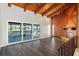 Spacious living room with wood-paneled accent wall and fireplace at 1141 Edgewood Ranch Rd, Orlando, FL 32835