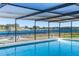 Inviting screened pool with lake view at 1141 Edgewood Ranch Rd, Orlando, FL 32835