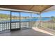 Lake view screened porch with wood floors at 1141 Edgewood Ranch Rd, Orlando, FL 32835