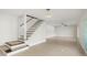 Modern staircase with dark wood accents and light walls at 1141 Edgewood Ranch Rd, Orlando, FL 32835