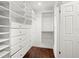 Bright walk-in closet with built-in shelving at 1141 Edgewood Ranch Rd, Orlando, FL 32835