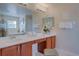 Elegant bathroom with a double vanity and plenty of counter space at 115 Essex Pl, Davenport, FL 33896